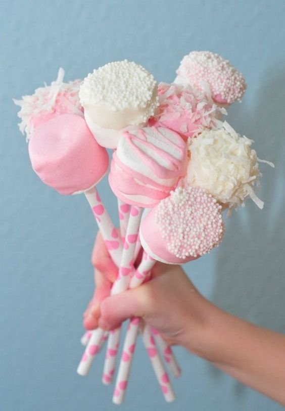 marshmallows planted on lollipop sticks
