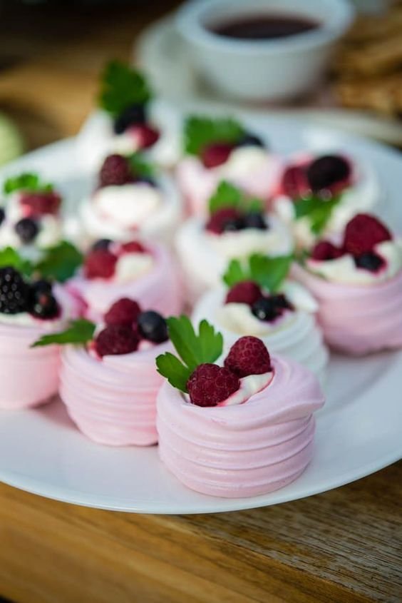 pink mini pavlova with cream and fresh fruits