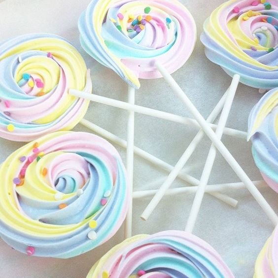 colorful meringues on lollipops