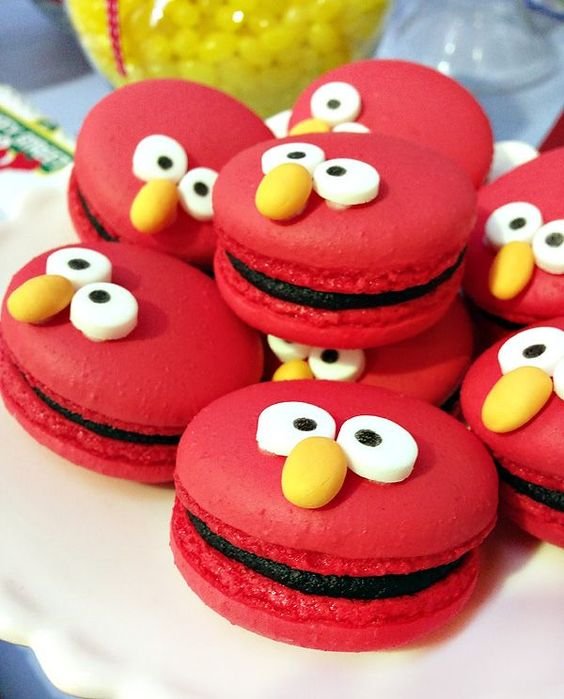 red macaroon with eyes and nose