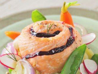 Roast salmon with blackcurrant fruit on bed of onions