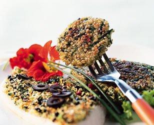 Halibut with olive crust and zucchini-quinoa cakes