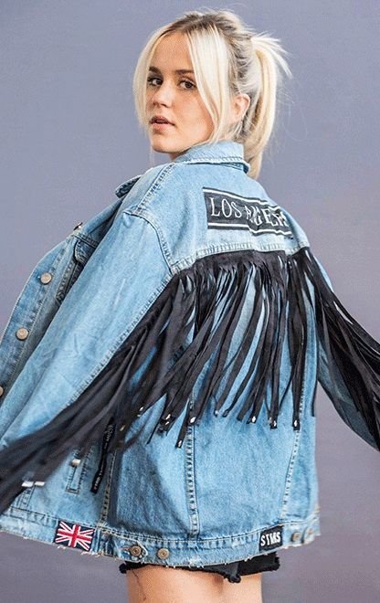 black fringes hung in the back and on the sleeves