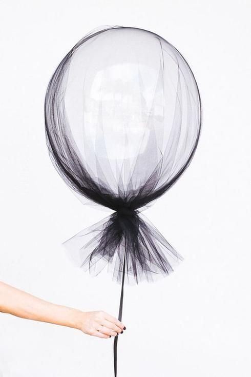 white balloon covered with black tulle