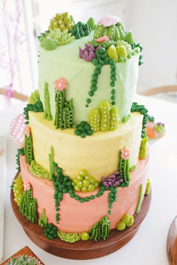 pastel cake in pastel shades with succulents in sugar paste