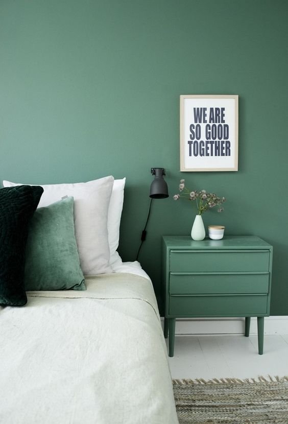 green toned walls in the bedroom