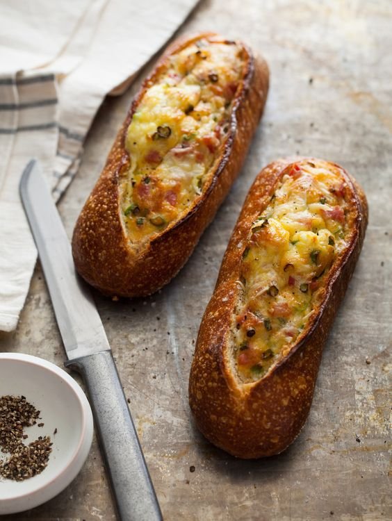 egg-based preparation of cheese and bacon in a baguette