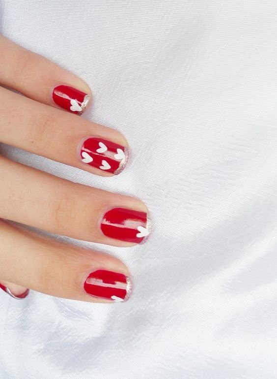 red nails, silver border, and little white hearts