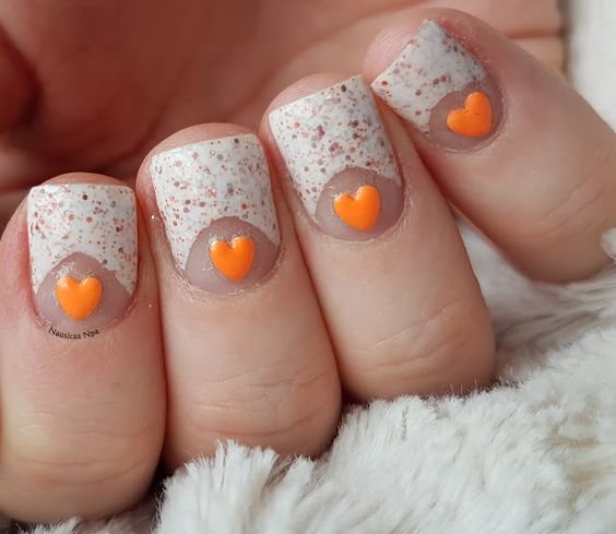 small orange hearts in relief, white and glitter