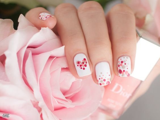 white polish and dots in pink camaieu drawing hearts