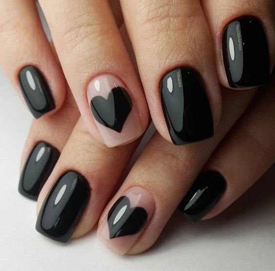 black heart on nude background and black nails