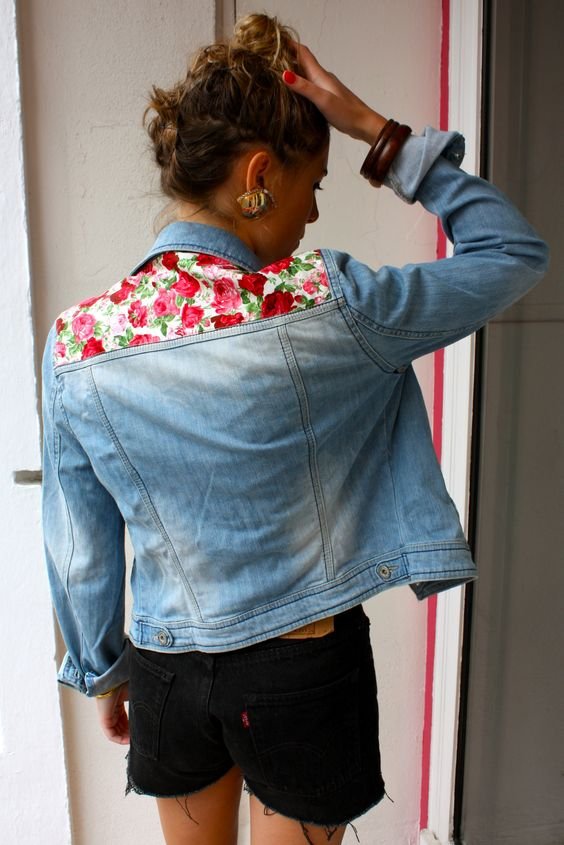 a strip of fabric on the back top of the jacket