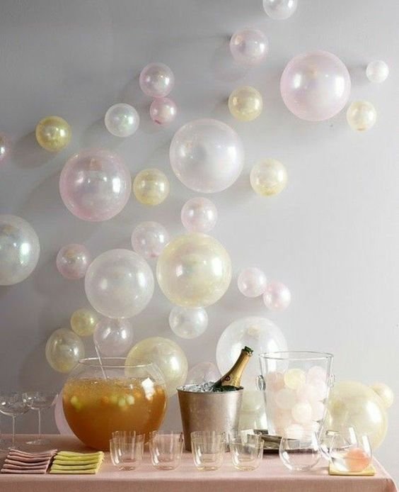 pearly balloons hanging on the wall behind the buffet