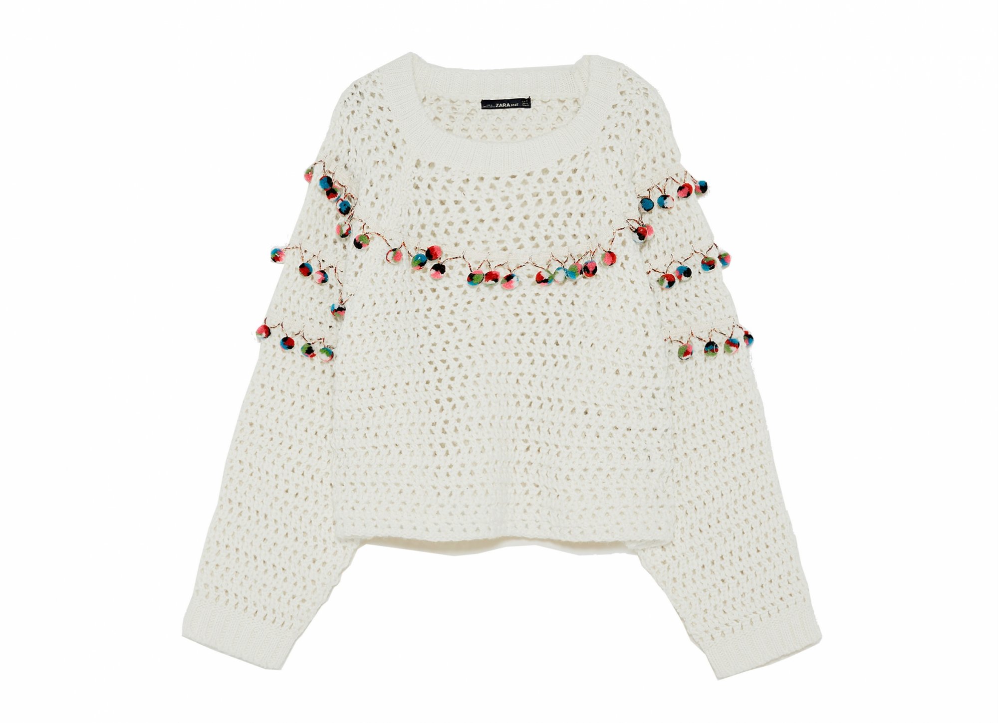 white sweater with small garland
