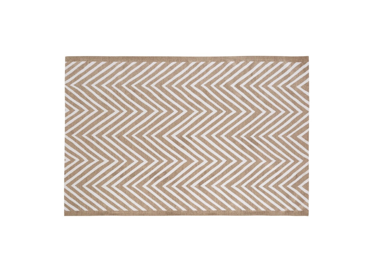 white zigzag patterned outdoor rug on nature background