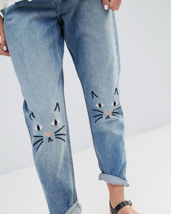 jeans loose with embroidered cat on knees