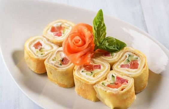 pancakes rolled with salmon and arranged like sushi