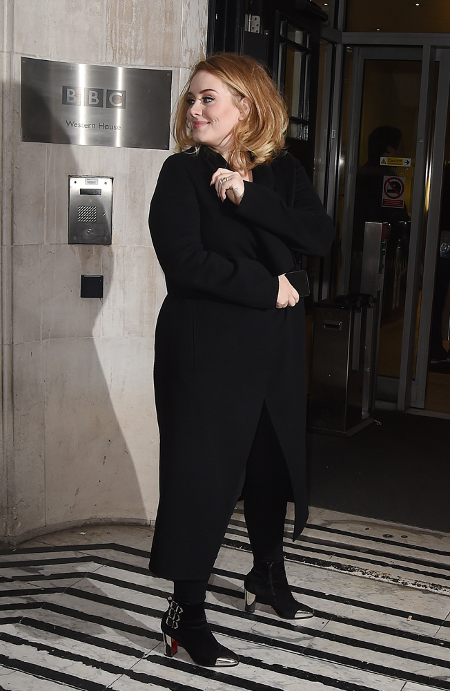 Adele in black coat